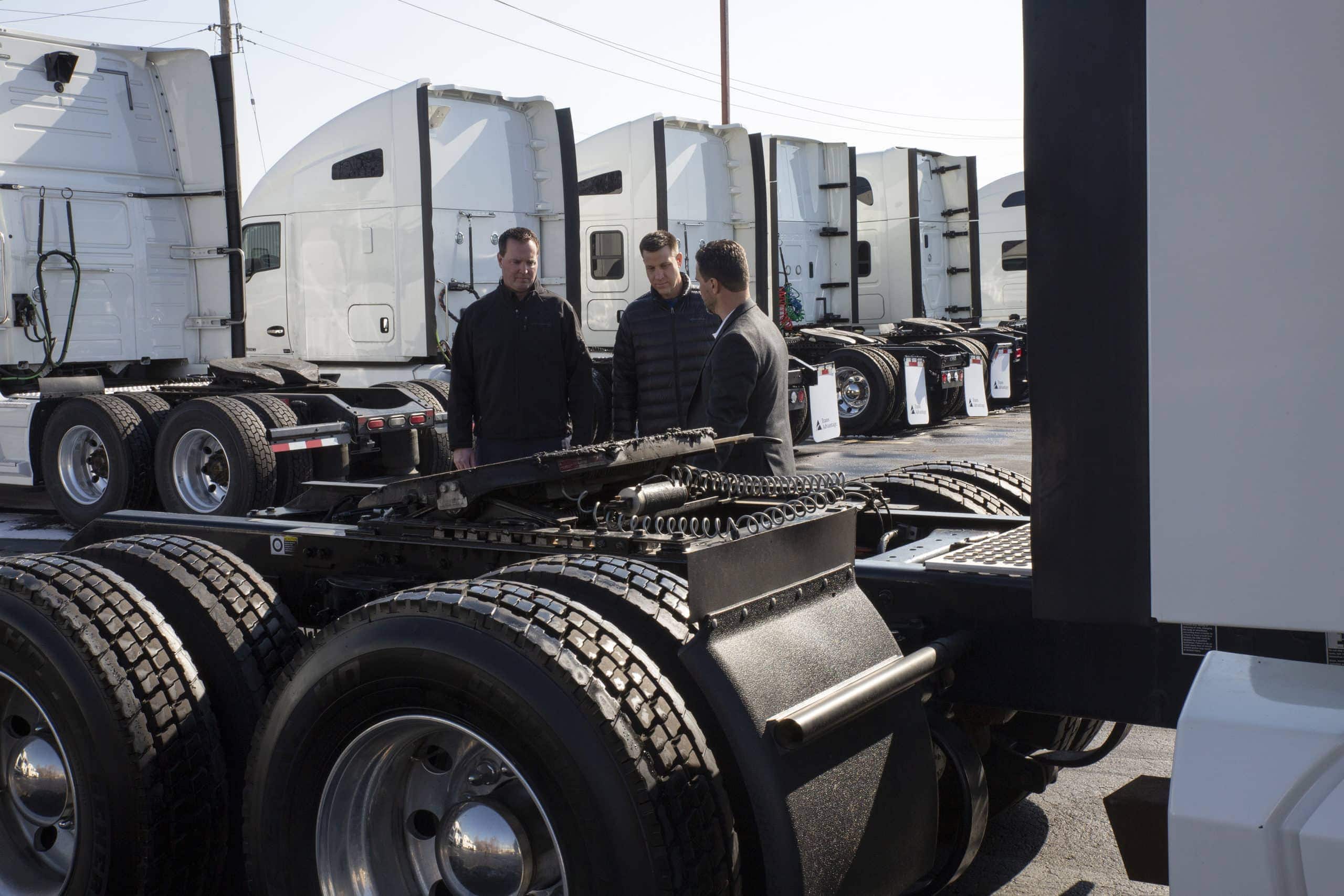 experts at trans advantage showing customer moving tractors